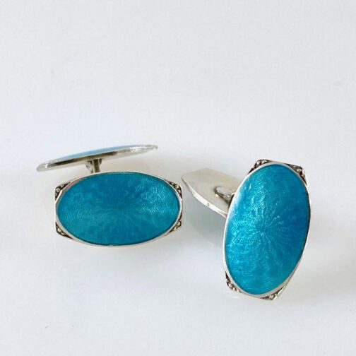 Silver with turquoise enamel turquoise cufflinks. Art deco detailed and cleverly crafted in silver with enamel, these cufflinks are placed in design history and pointng towardsart history.