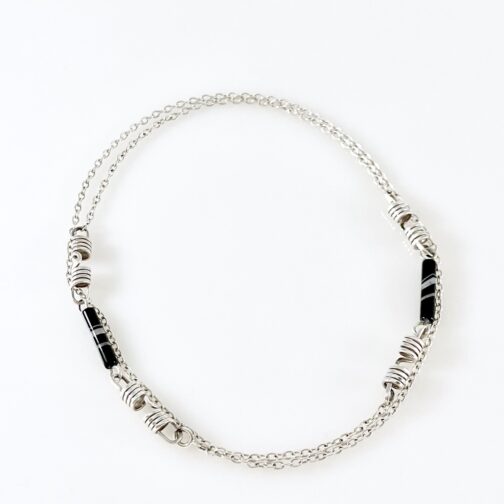Long necklace by Anna Greta Eker for PLUS. Made in silver with stones.