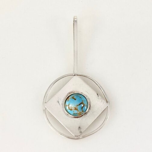 Silver with turquise pendant by Astri Holthe, showing circles and squares against each other.