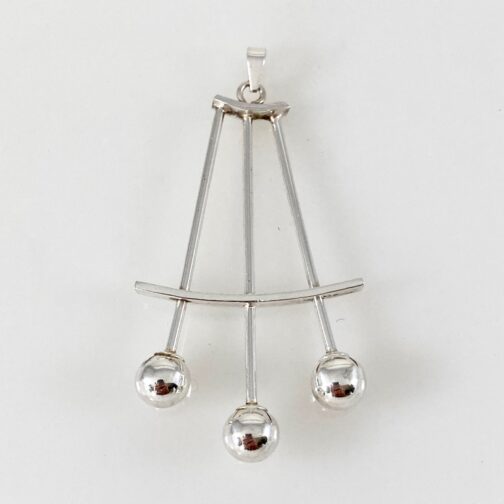 Pendant by Albert Scharning. Silver in playful geometry. Scandinavian Mid Century Modern Jewelry from a small scale and somewhat exquisite production.