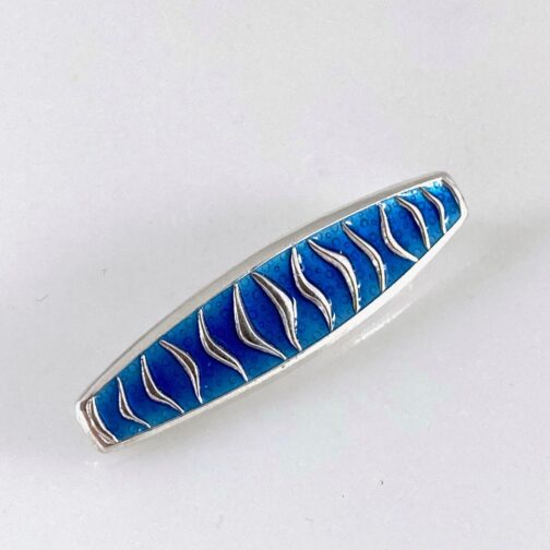 Brooch by Agnar Skrede for D-A, silver with blue enamel. This brooch is typical of Scandinavian Mid Century Modern Jewelry.