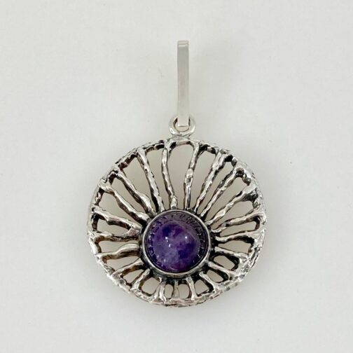 Pendant by Bengt Hallberg, with an amethyst set in sterling silver giving the pendant a sensitive yet clear and strong expression. Swedish MCM jewelry. This family business was founded in 1947.