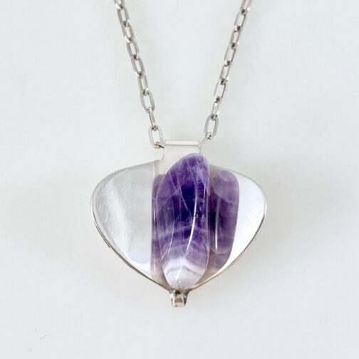 Pendant by Erling Christoffersen for PLUS. In silver with agate. In this design, the silver mirrors the large agate. One of Christoffersens most treasured and characteristic designs.