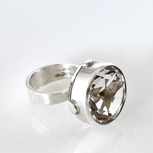 Erik Granit silver ring with rock crystal. Powerful expression, with the gentle cradeling of the huge stone and the silver structutre holding it merging tradition with a more exuberant language.