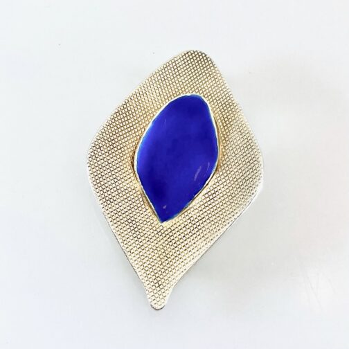 Silver blue enamel brooch by Grete Prytz Kittelsen for Tostrup, silver gilt, in her "With Points" series. Scandinavian Mid Century Modern Jewelry from a master.