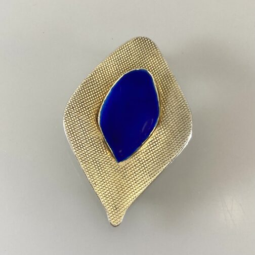 Silver blue enamel brooch by Grete Prytz Kittelsen for Tostrup, silver gilt, in her "With Points" series. Scandinavian Mid Century Modern Jewelry from a master.