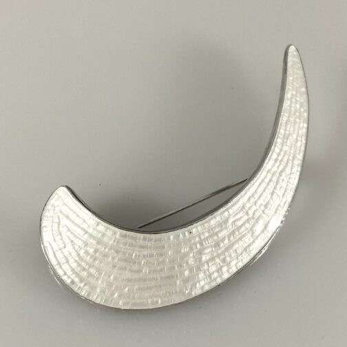 White crescent by Grete Prytz Kittelsen. Her very characteristic Half Moon/Crescent brooch. Scandinavian Mid Century Modern Jewelry from a master!
