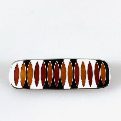 Red brooch by Hannelore Sorge in matte enamel, in Sorge's very distinct style making a weighty contribution to Scandinavian Mid Century Modern jewelry.