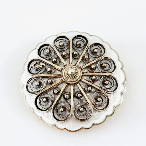 Brooch by Ivar T. Holth. Silver gilt, rooted in history and wrought in tradition, the piece is rought forth in filigree technique and enamel; the material that would come to spell modernity.