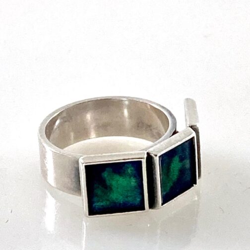 Marianne Berg ring for David-Andersen, made in silver with enamel. Strict geometric shapes merge with the non-figurative patterns made in the enamel.
