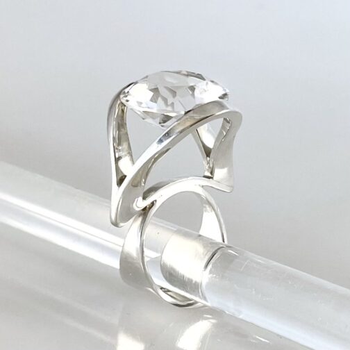 Stunning silver ring by Marianne Berg for Uni David-Andersen, featuring a large, cut rock crystal on a striking high setting.