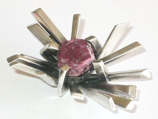Silver and ruby brutalist brooch. Silver brooch with rough, uncut (and probably Norwegian) Ruby. Brutalist expression from modernist master Øivind Modahl of Oslo.