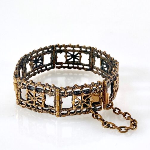 Bracelet by Pentti Sarpaneva, in bronze with the intricate pattern for which inspiration was found on traditionalold Finnish craft workmanship.