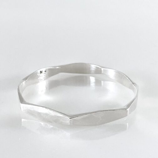 Bracelet by Ragnar Hansen for PLUS/ND. Made in silver, exposing geometry in circle and angles in this Norwegian MCM piece of jewelry.