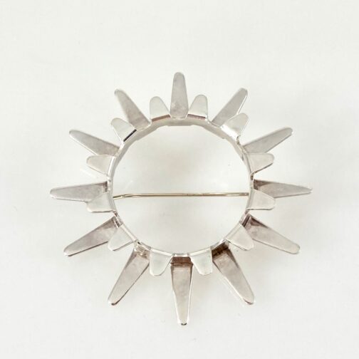 Sun brooch by Tone Vigeland for PLUS. One of her best known designs, executed in silver. MCM Jewelry from she who became one of the prime exponents.