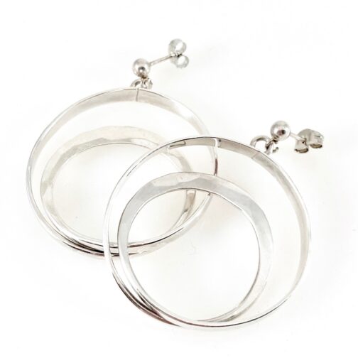 Tone Vigeland earrings for PLUS. Twirling pieces of silver making double circles in the design simply denoted H82 in the PLUS records.