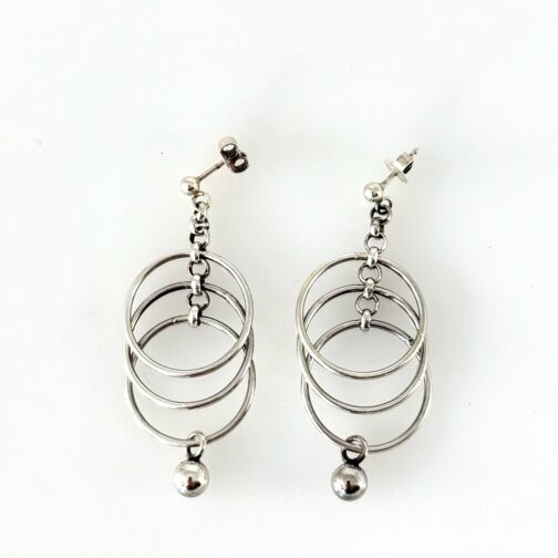Tone Vigeland RINGS earrings for PLUS. Discover elegant Tone Vigeland earrings for PLUS. Her simple design of rings put together for a kinetic piece of pure elegance.