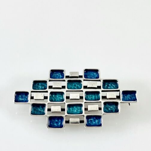 Combined brooch pendant by Uni David-Andersen (studio). Delicate piece in silver with careful enamel work all over.