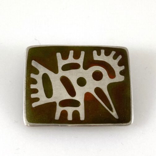 Enamel silver brooch by Uni David-Andersen for the David-Andersen company. The piece takes on the morphology of the expeditons of the era.
